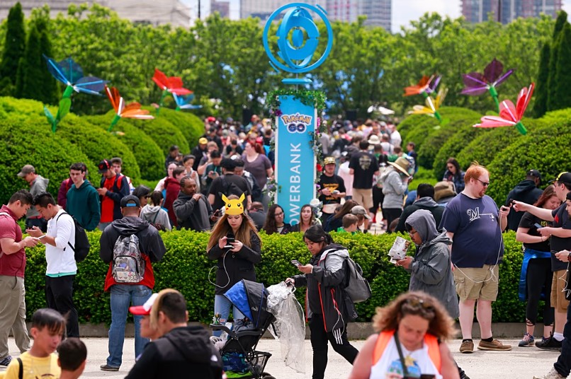 Participants at Pokemon GO Fest 2019 while searching for characters as they play Pokemon GO (AP Photo/Amr Alfiky)